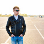 Modern men's leather jacket fashion on a city street