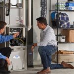 HVAC technician inspecting a residential furnace for potential repair issues in Mississauga Ontario, Canada