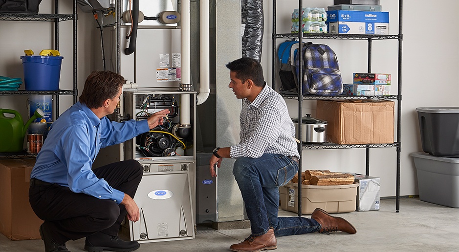 HVAC technician inspecting a residential furnace for potential repair issues in Mississauga Ontario, Canada